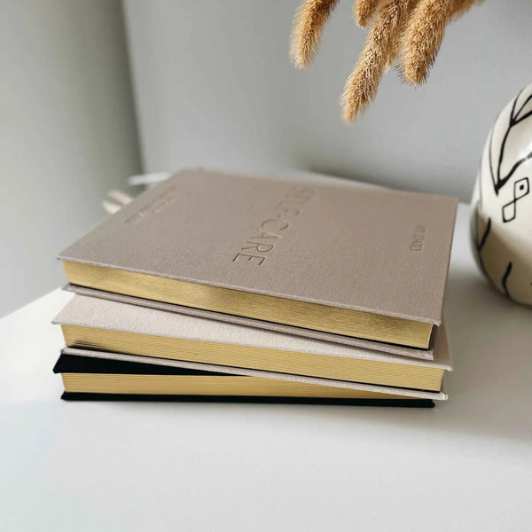 BLUSH AND GOLD DAILY SELF CARE INTENTIONS AND GRATITUDE JOURNAL - PEBBLE